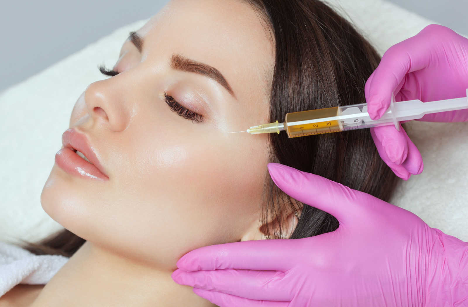 Nurse applying PRP to a client's face
